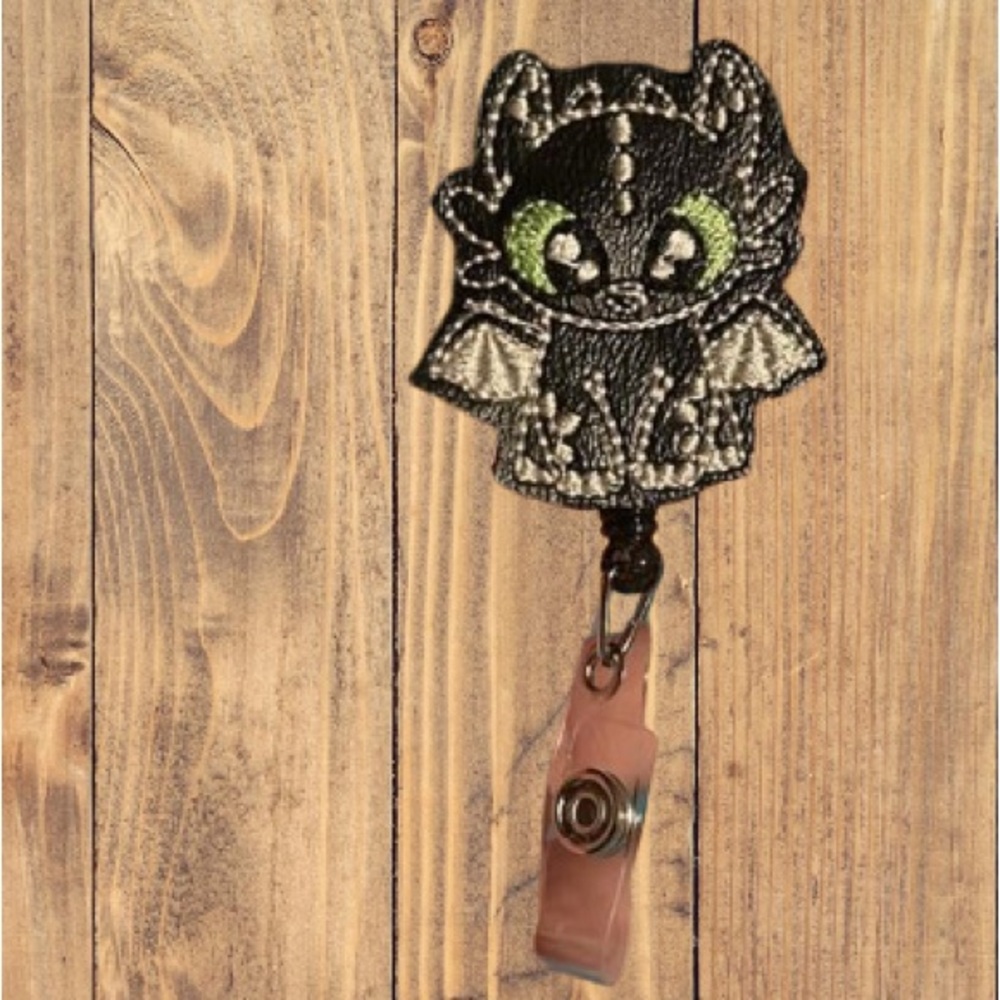 Custom black dragon badge reel